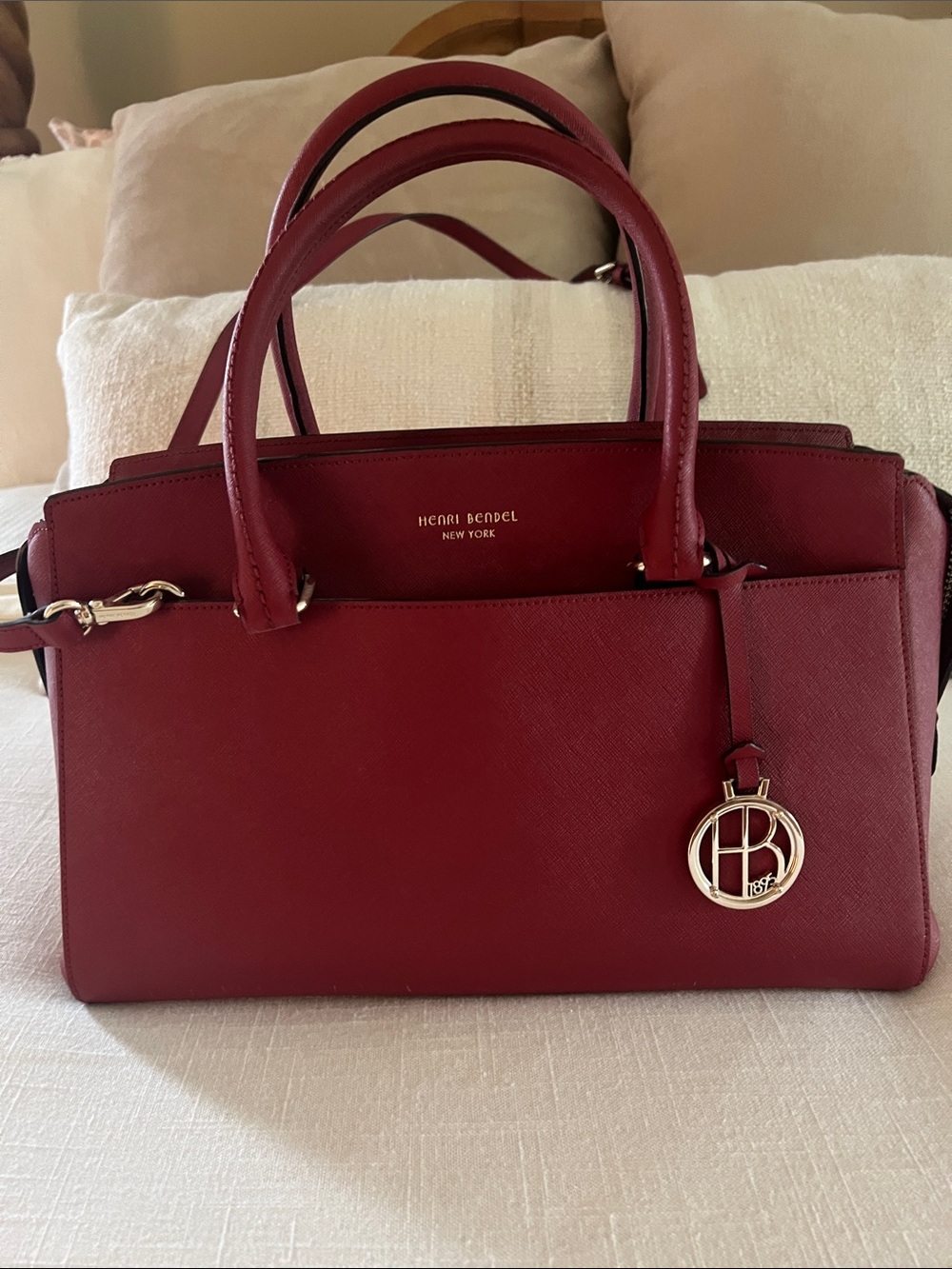 henri bendel burgundy saffiano leather satchel with logo charm